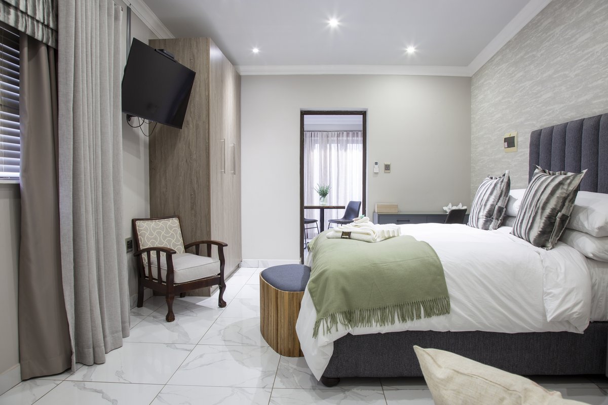 Queen Suite bedroom with view through to the private sitting nook
